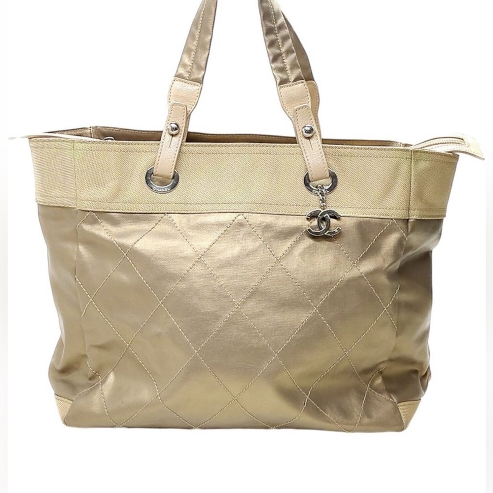 Chanel tote Bag Coated Gold Canvas luxury item.